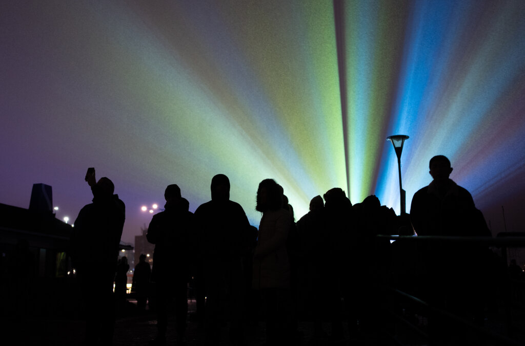 People watching an artwork at Nobel Week Lights 2024
