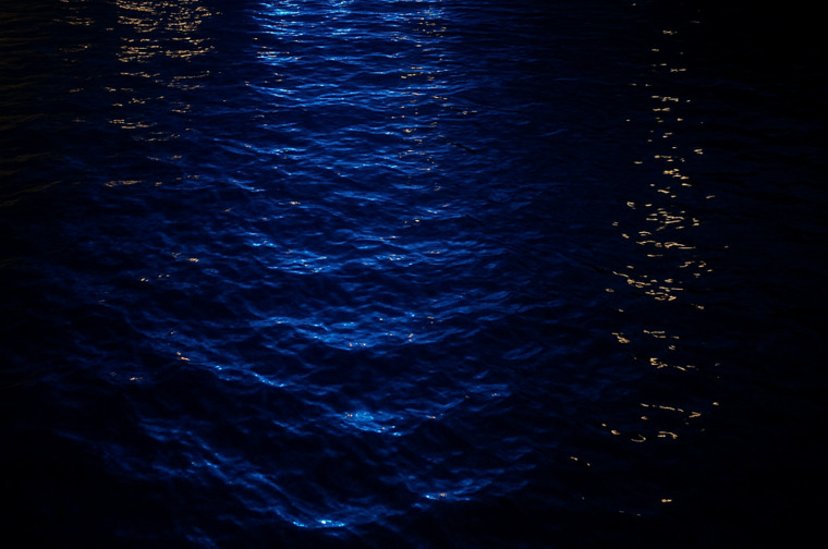 Dark water with light reflected